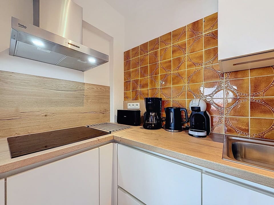 Kitchen, Countertop, Kitchen Appliance, Flooring, Wood, Major Appliance, Interior Design, Floor, Cabinetry, Tile
