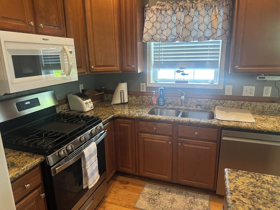 Granite countertops, gas stove, microwave, & dishwasher.