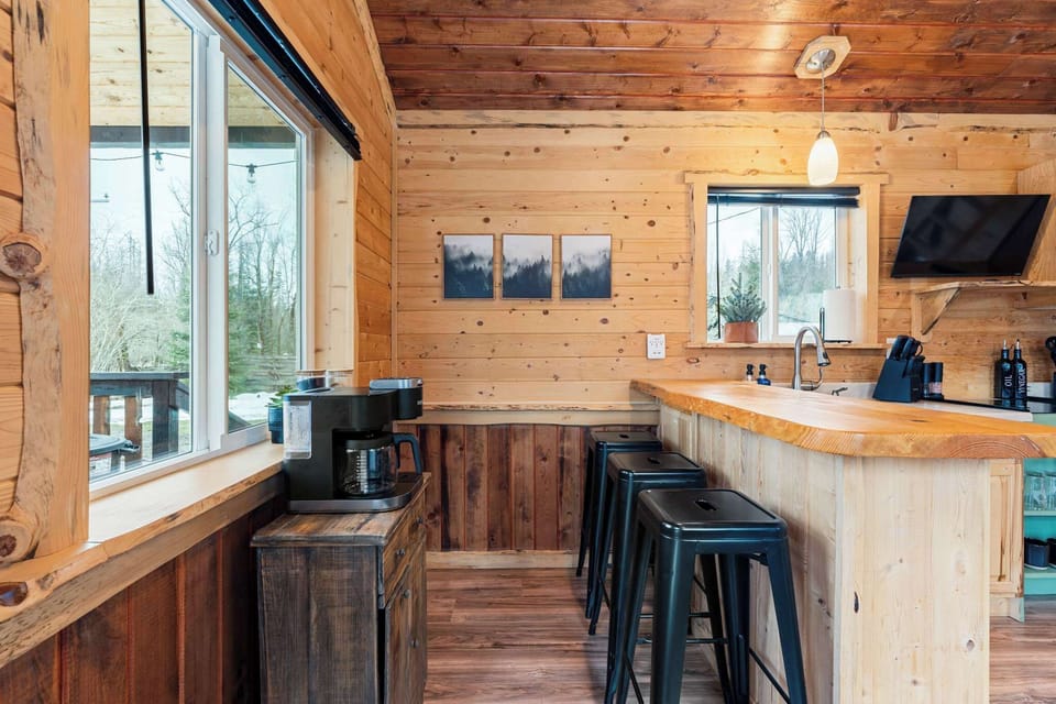 Breakfast bar seating overlooking the open living space.