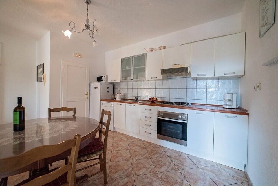 Villa | Private kitchen | Fridge, microwave, oven, stovetop