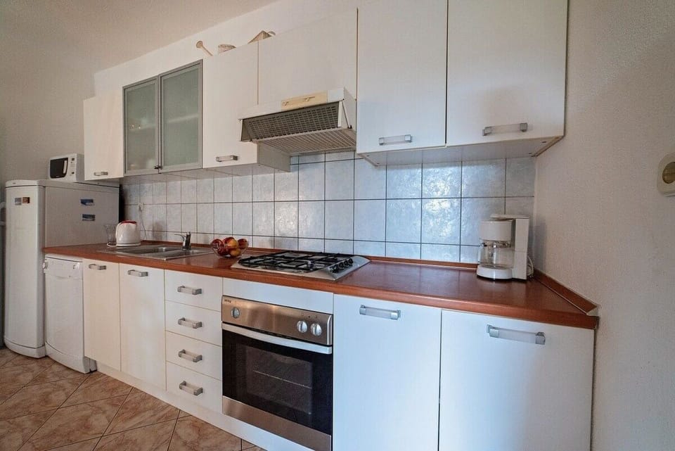 Villa | Private kitchen | Fridge, microwave, oven, stovetop