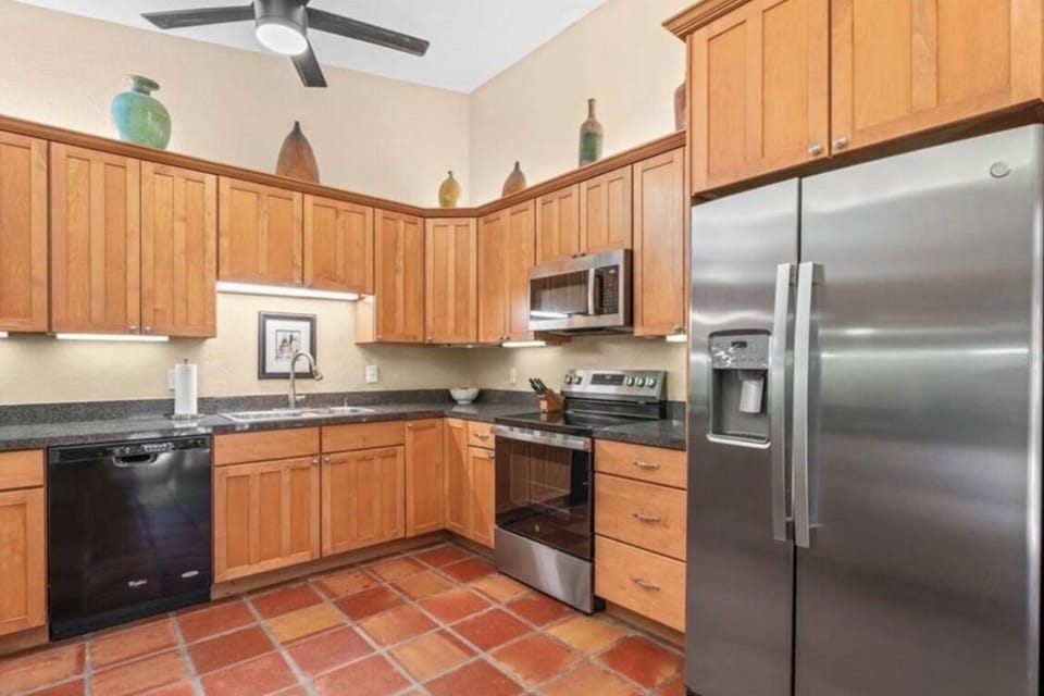 Fully equipped kitchen with stainless steel appliances.”
