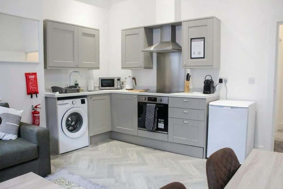Bright, modern kitchen with everything you need—fully equipped, stylish, and perfect for a comfortable stay.