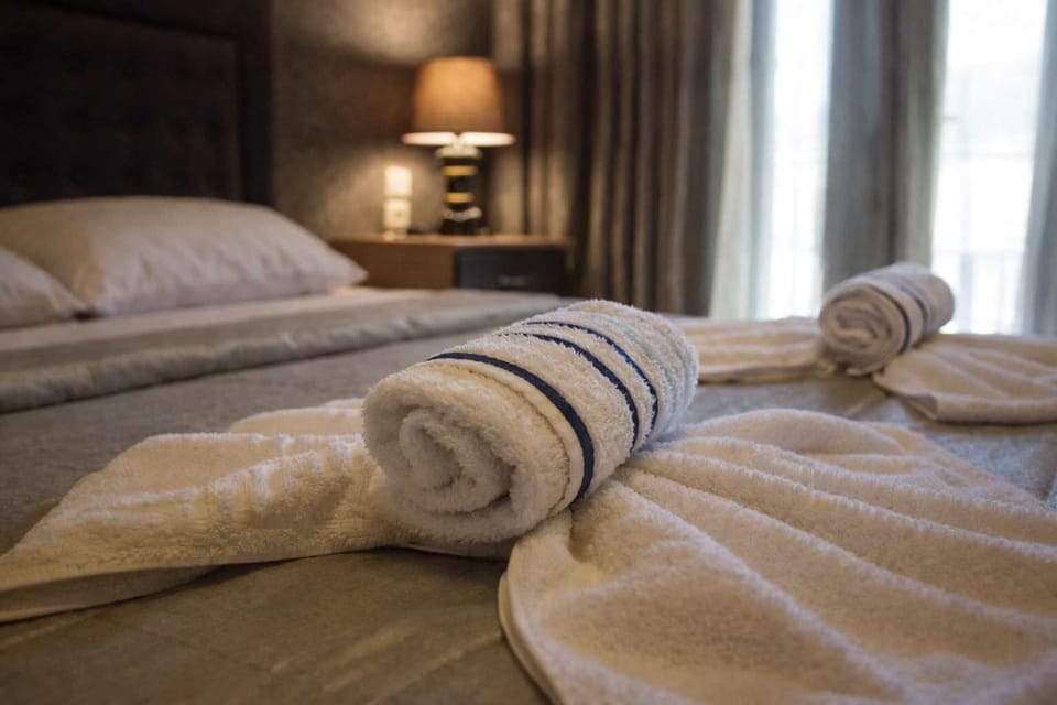 Cozy Bedroom with Fresh Linens and Warm Lighting