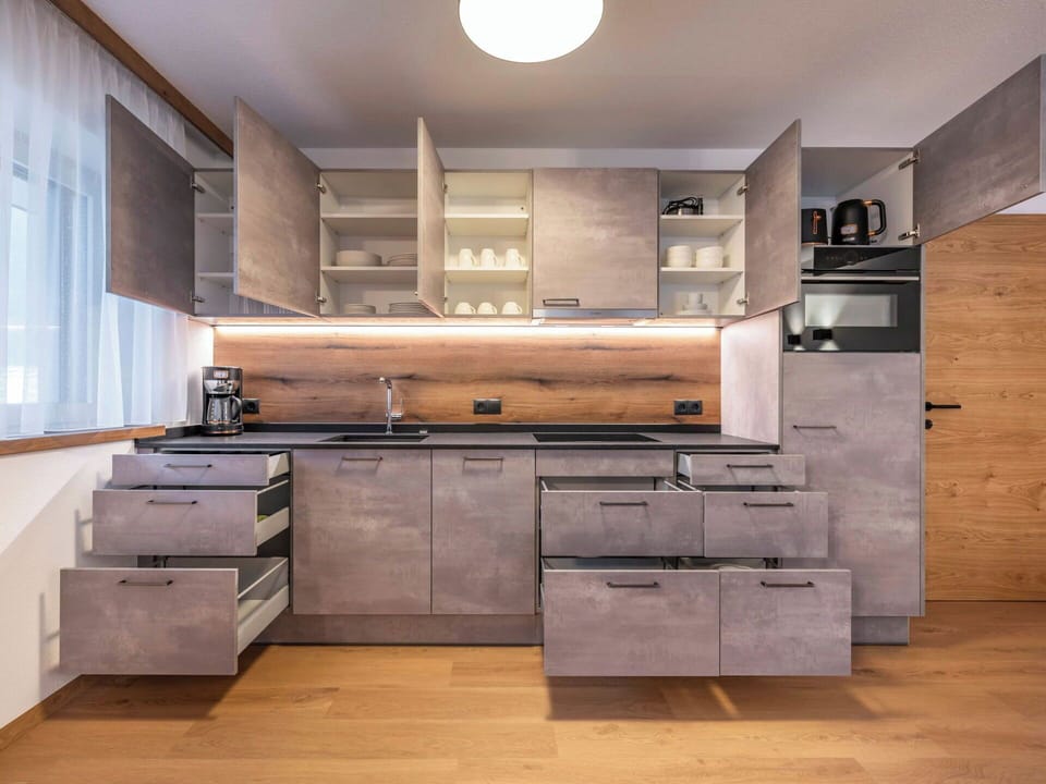 Furniture, Kitchen, Kitchen Appliance, Cabinetry, Countertop, Interior Design, Flooring, Wood, Major Appliance, Home Appliance