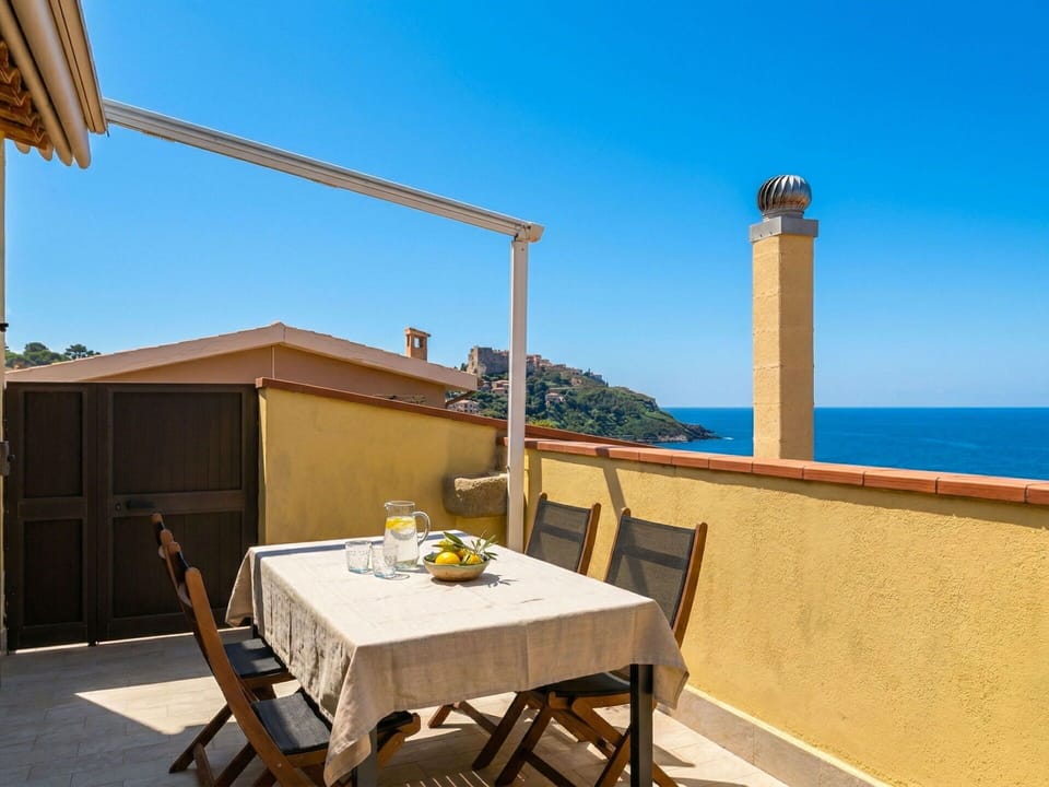 Wood, Flooring, Floor, Furniture, Sea, Wood Stain, Balcony, Shade, Chair, Ocean