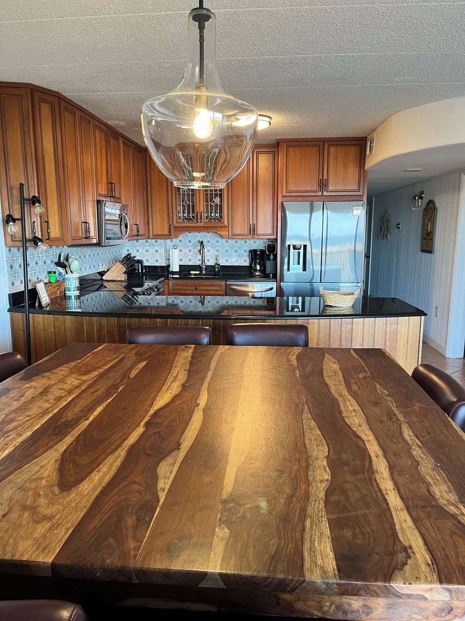 Oceanfront dining area with stunning beach views—perfect for family meals, morning coffee, and sunset dinners in Ocean City, MD.