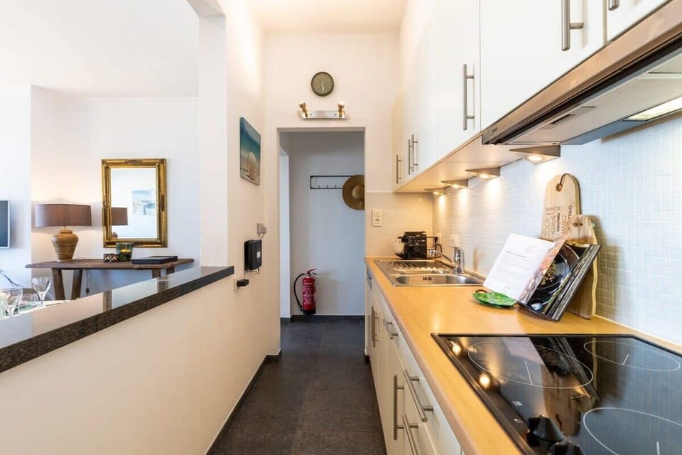 Modern kitchen with sleek cabinetry and integrated lighting for a comfortable cooking experience.