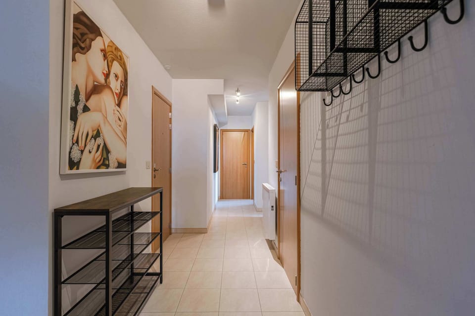 Cloth Rack, Shoe Rack, Hallway art and mirrors — coastal charm throughout.
