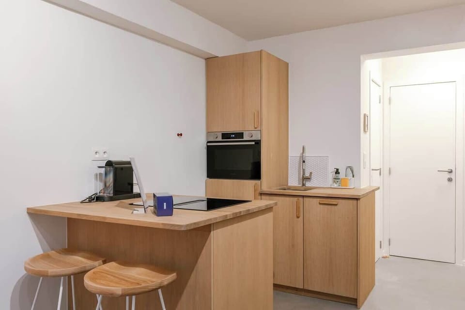 High-end finishes and built-in appliances make this compact kitchen as functional as it is beautiful.