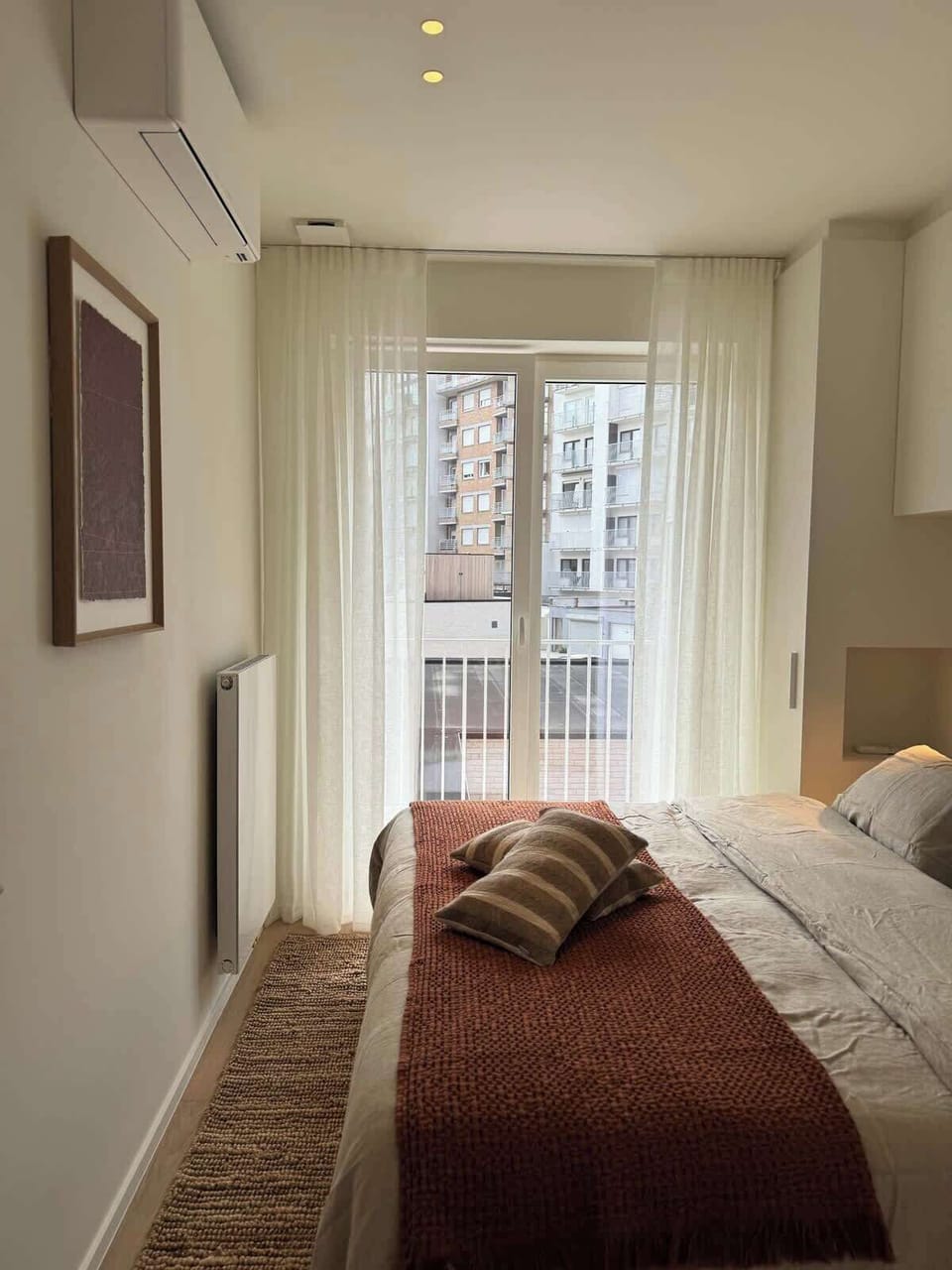 Bedroom with Balcony Access
Bright bedroom with direct balcony access and cozy design touches.