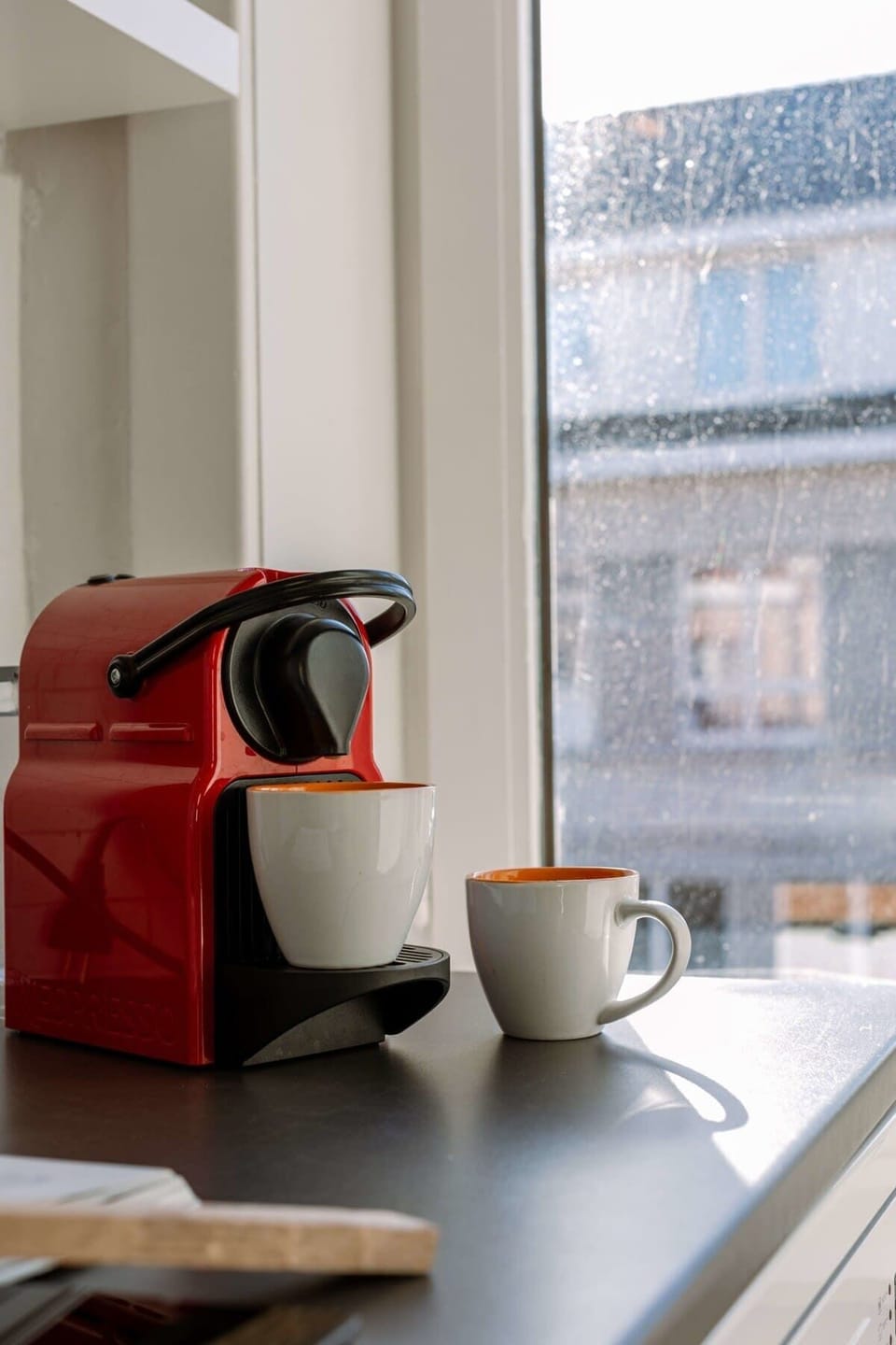 Compact coffee corner with sea views and fresh morning light.
