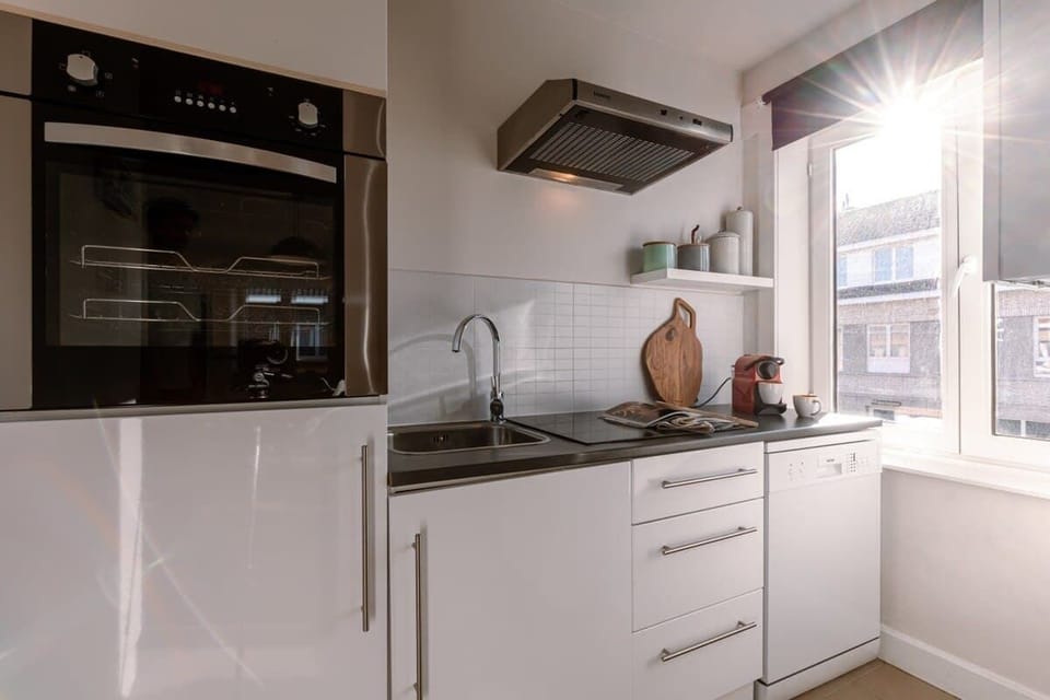 Fully equipped kitchen with modern appliances and elegant simplicity.
