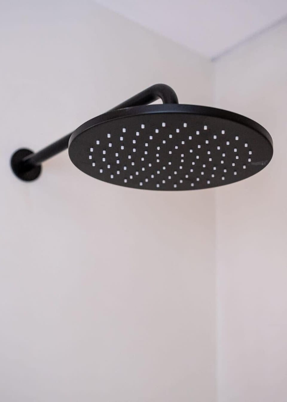 Modern black rain showerhead for a relaxing shower experience