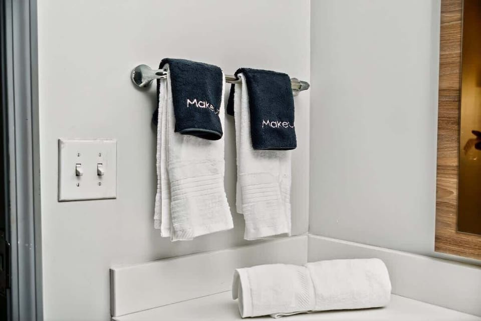 Stylish towels embroidered “Makeup” — small but impressive hospitality detail showing guest-minded preparation.