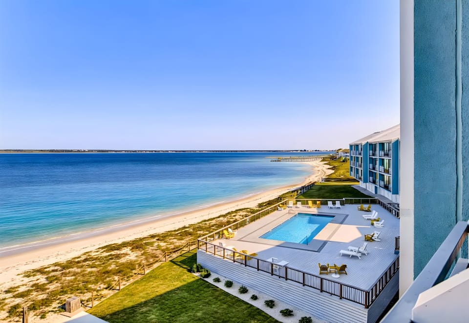 From above, soak in stunning views of the beach, coastline, and sparkling blue water.