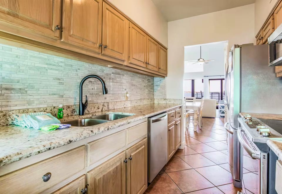 Bright and functional, the kitchen is stocked with everything you need for your stay.
