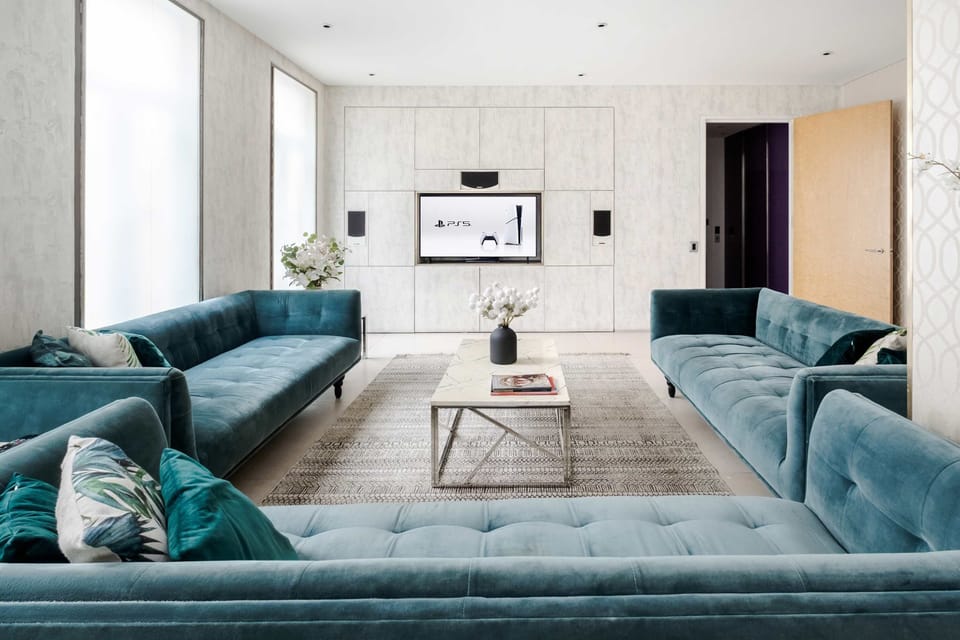 Living Room | Elegant luxury living room with a stunning OLED TV, stylish furnishings and refined décor. Fully air conditioned for year round comfort, creating a calm and sophisticated space to relax or entertain.