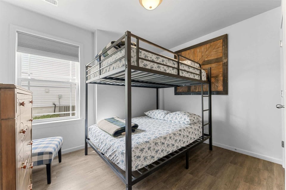 The first bedroom offers a cozy full-over-full bunkbed & smart TV​