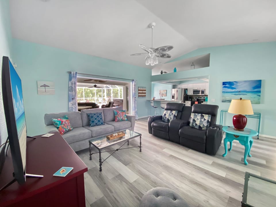 Bright living room with comfy seating and open view to the patio.