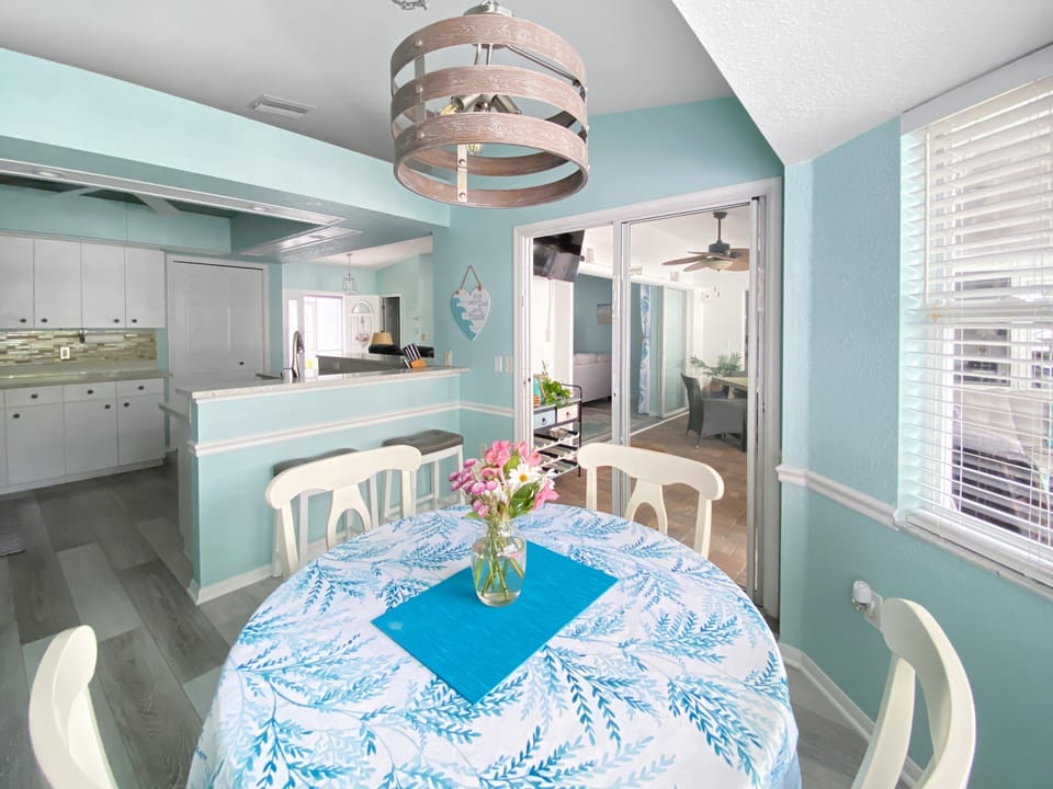 Charming dining area with natural light and coastal decor, perfect for family meals.