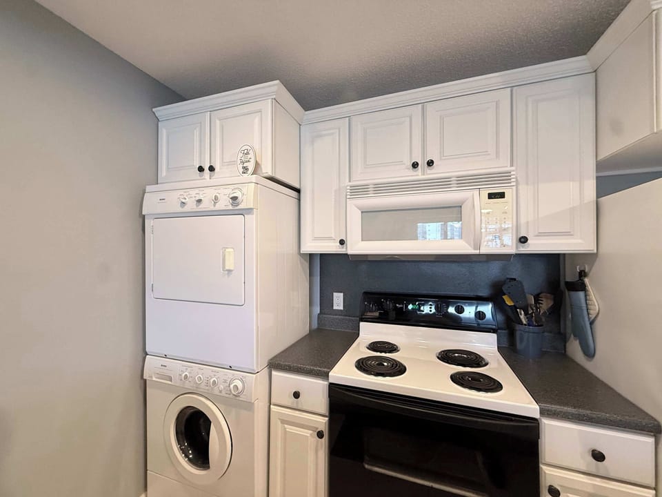 The open kitchen offers ample space & all the comforts of home​