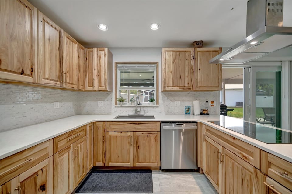 Kitchen with wood cabinets and full appliances