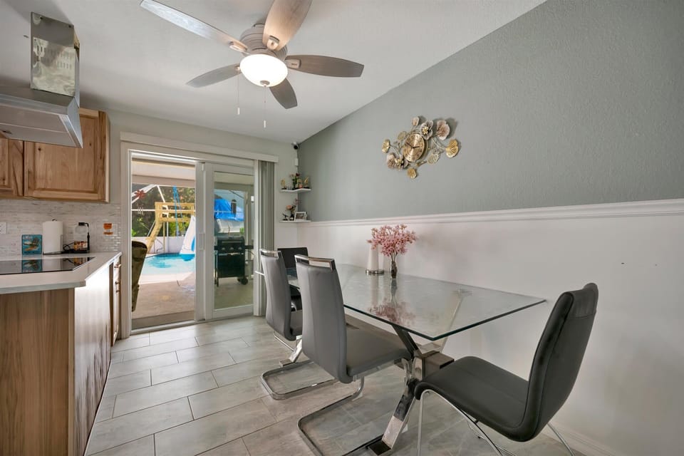 Dining area with glass table and modern seating