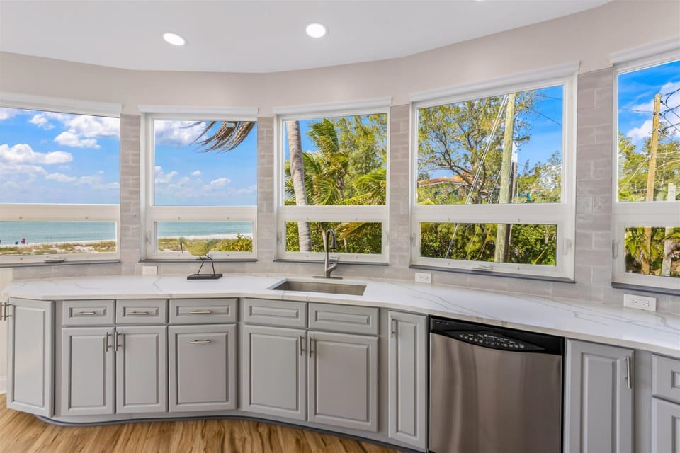 Spacious kitchen with dishwasher and wraparound counters
