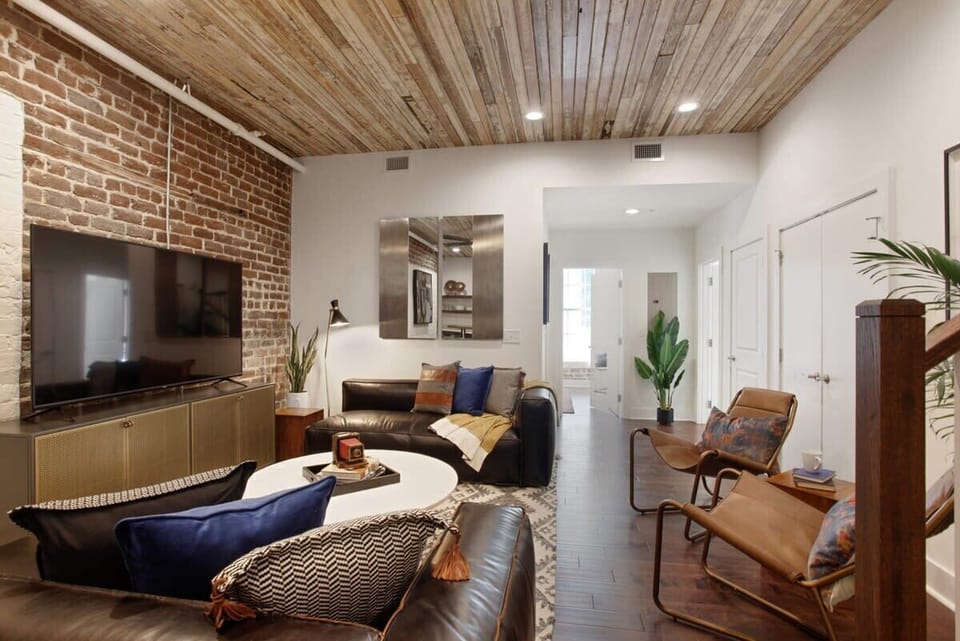 Living Room | Comfortable Seating Area and TV | First Floor of Third Floor Unit