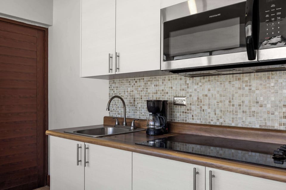 Kitchen sink and mosaic tiles