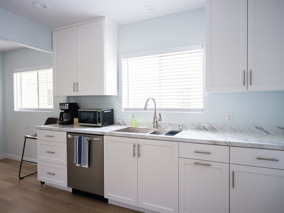 Stainless appliances and coffee for breakfast prep