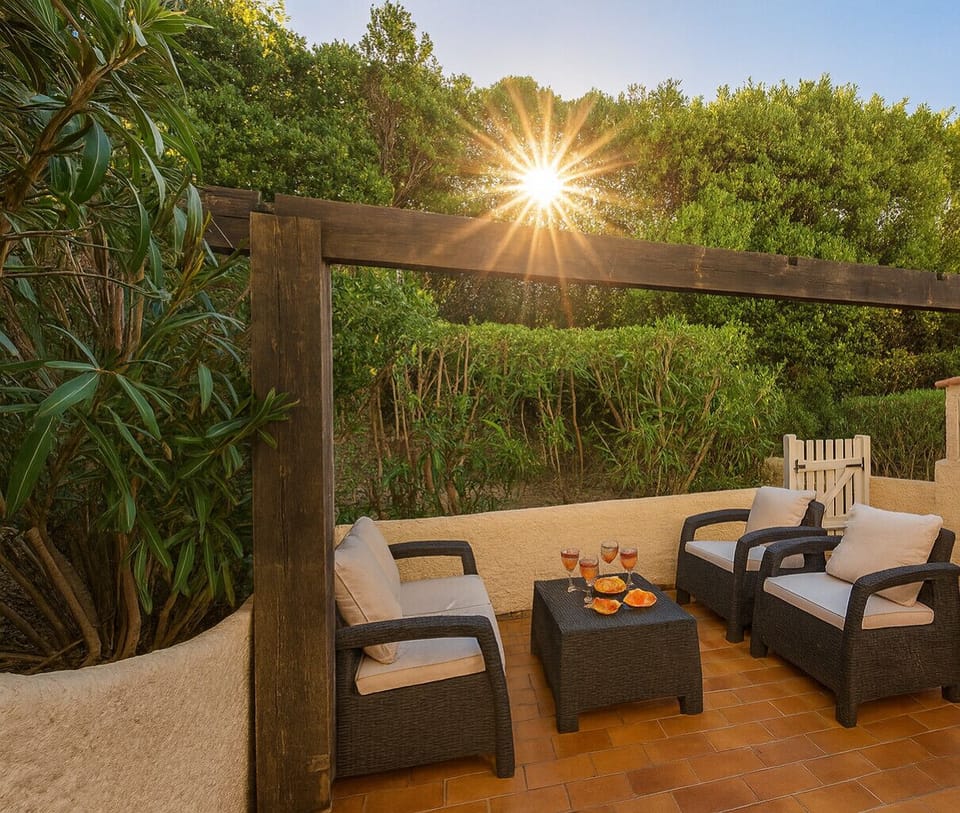 Rear terrace with garden furniture and garden view