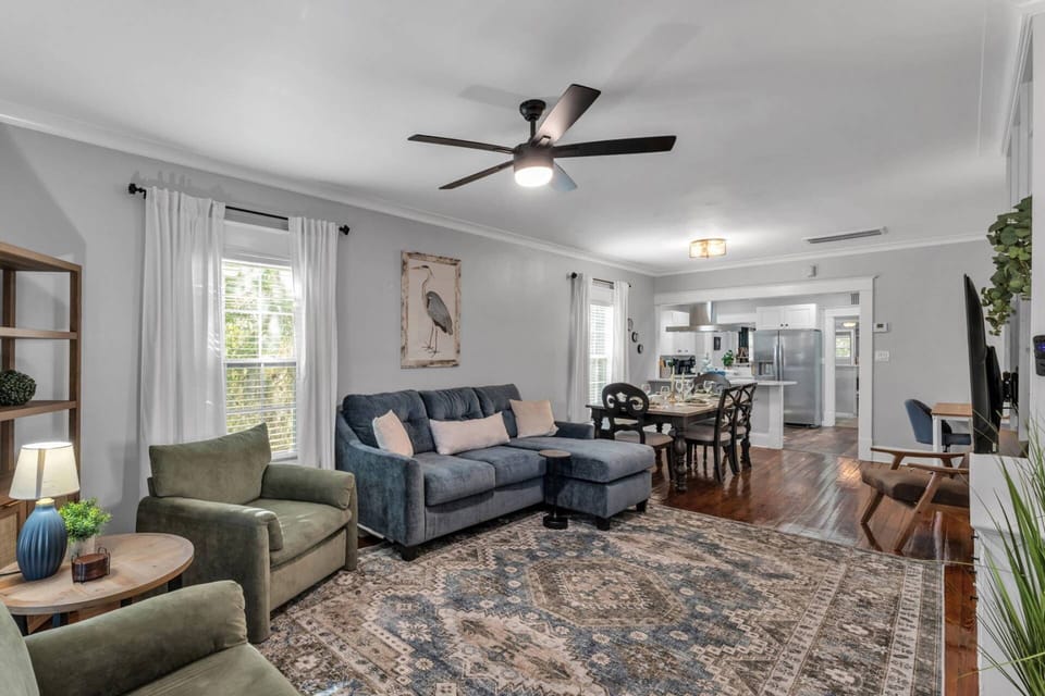 Bright, airy living space with comfortable seating and natural light—perfect for relaxing, gathering, or streaming your favorite shows.