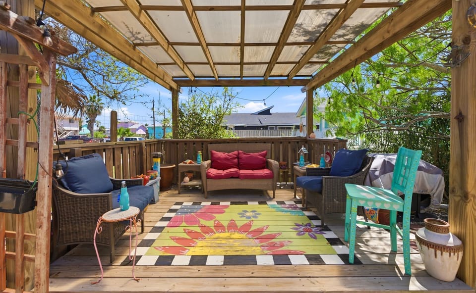 Covered Deck — Wicker Furniture, Painted Floral Rug & BBQ Grill