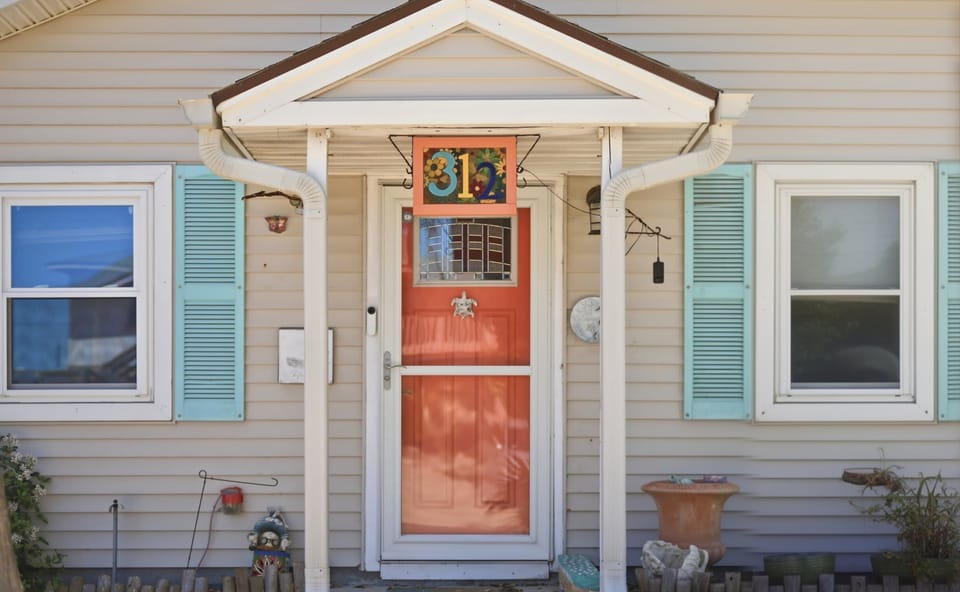 Front Door — Coral Door with Turtle Knocker & Colorful 312 Address Tile