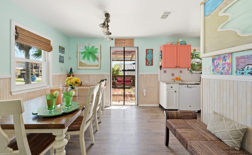 Dining & Kitchen — Farmhouse Table, Coral Cabinets & Sliding Door to Covered Deck