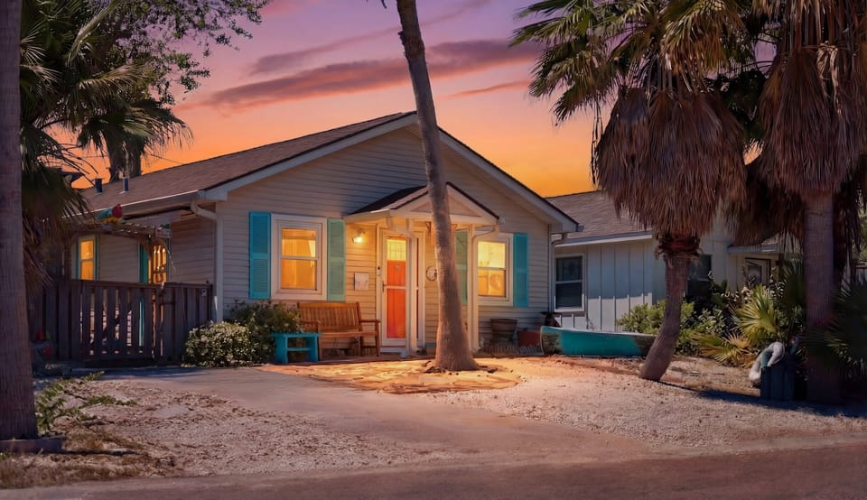 Exterior at Sunset — Charming Cottage with Turquoise Shutters & Coral Door