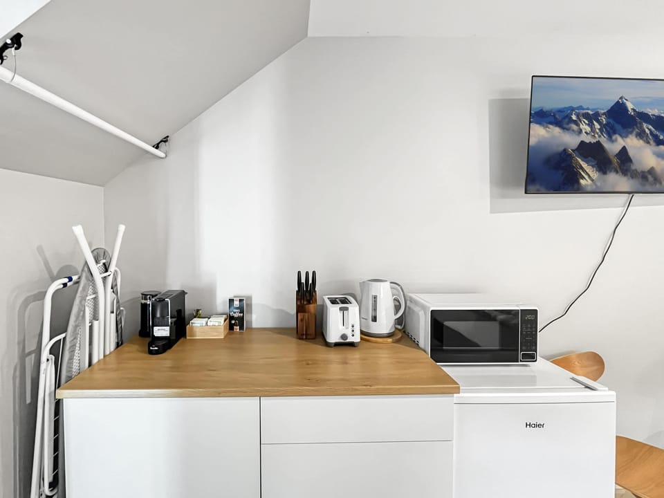 Compact kitchenette for light meals and morning coffee