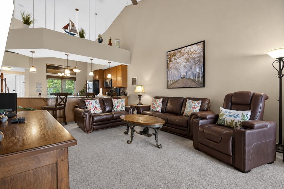 Living Room with access to both the Balcony and Sunroom