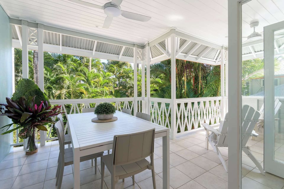 Elevated tropical balcony surrounded by lush palm views
