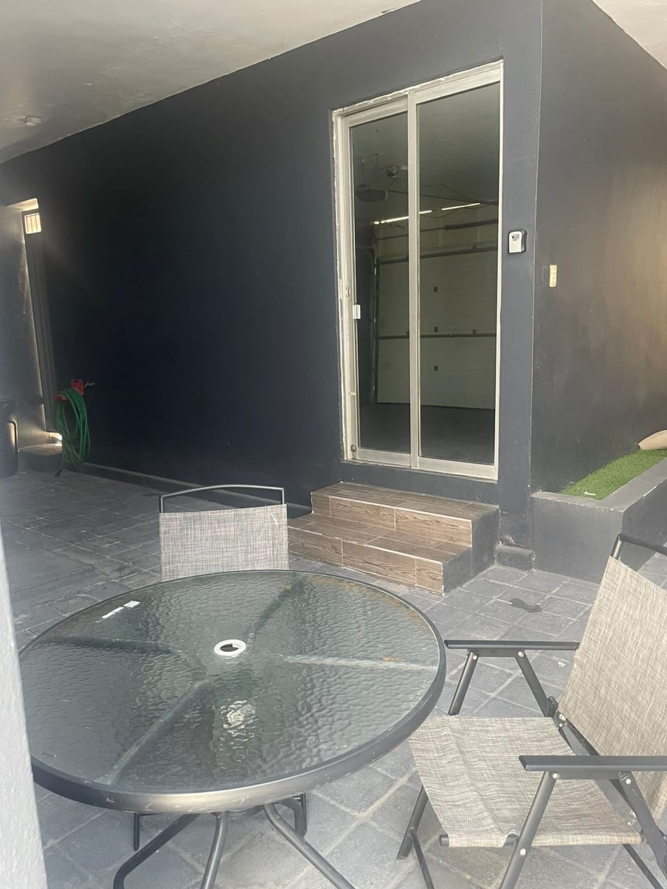 Cozy outdoor space with a small table and two chairs