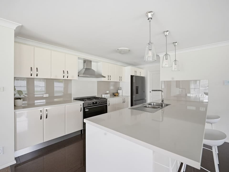 Well-Equipped Kitchen + Breakfast Stools