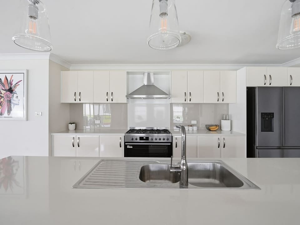 Well-Equipped Kitchen + Breakfast Stools
