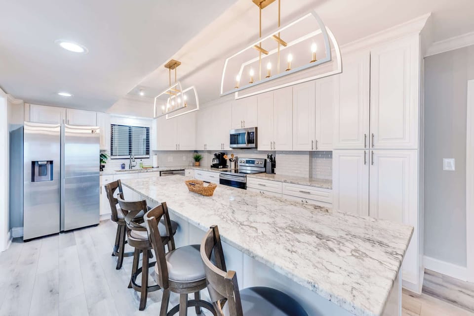 Enjoy cooking and entertaining in Chef's kitchen with 4 barstools at kitchen island