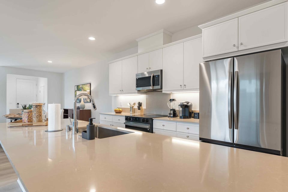 Modern stainless steel appliances and designer backsplashes elevate every meal prep.