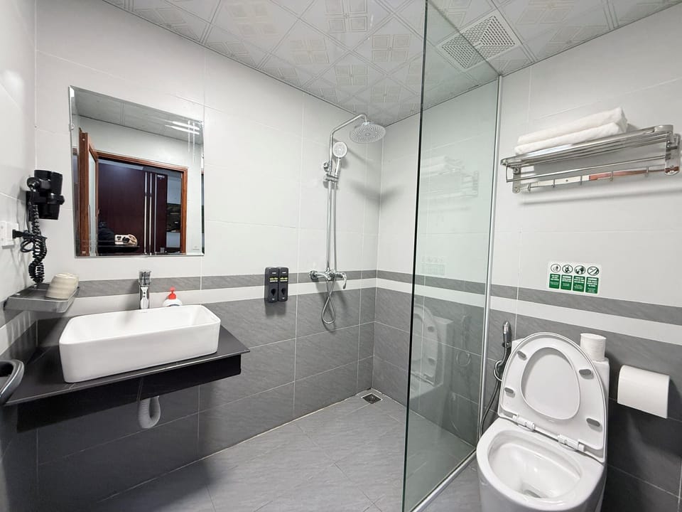 Family Room, City View | Bathroom | Shower, hair dryer, towels, soap