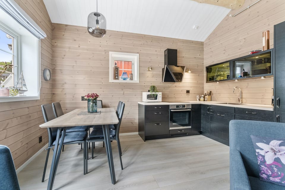 Dining room with a fully equipped kitchen