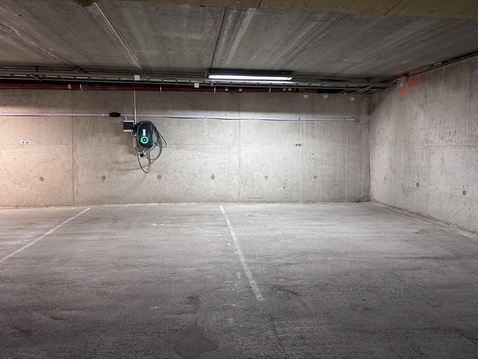 Electric vehicle charging available at the parking spot.