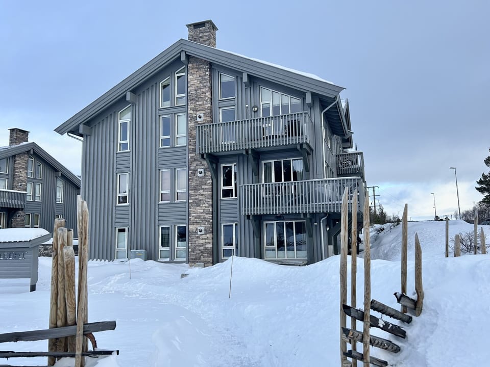 Modern, alpine-style building where the apartment is located